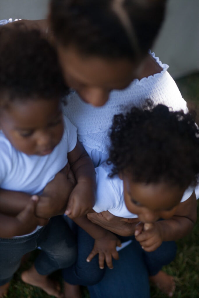 austin texas motherhood portrait of mother holding two children