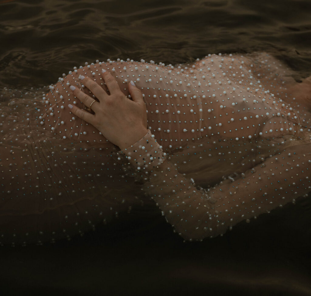 faceless maternity portrait in water in austin texas 